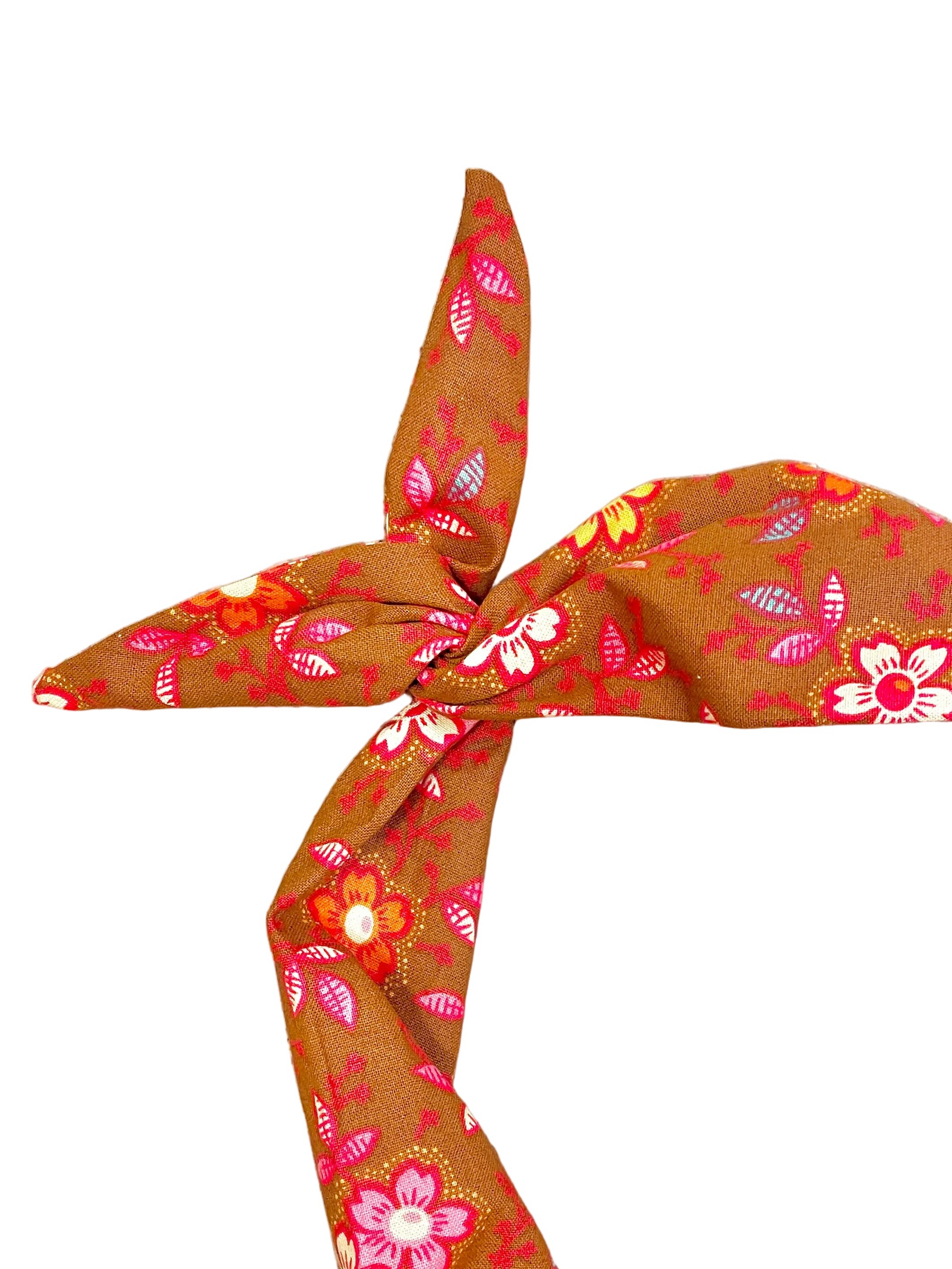 Amanda Bright Designs tie headband in fall colors of cinnamon with orange, pink, yellow and white flowers with a touch of baby blue