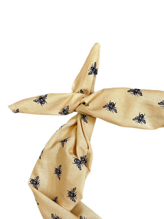 Amanda Bright Designs stylized navy blue honey bees on a khaki colored 100% cotton headband