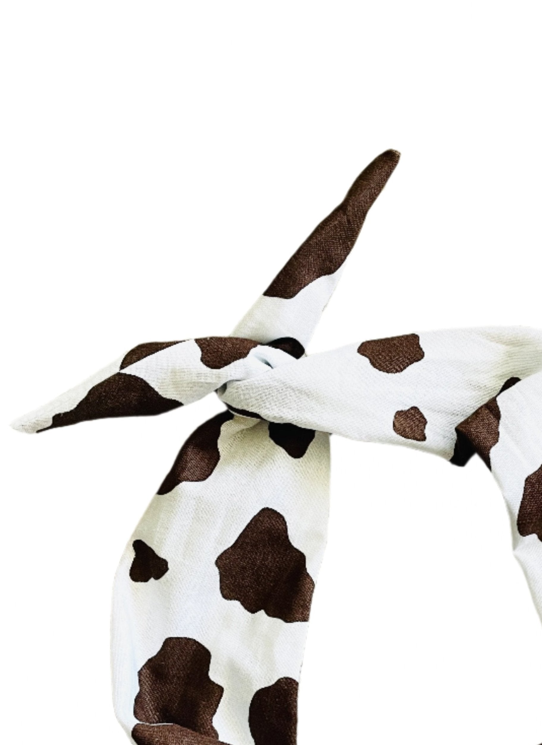 Amanda Bright Designs cotton fabric headband with a brown cow print pattern, tied in a knot at the top