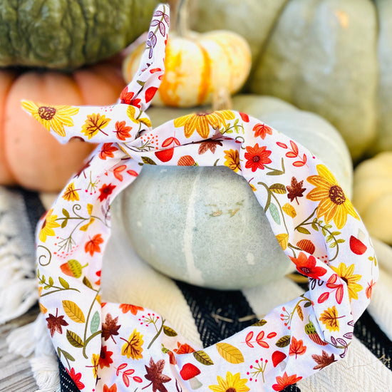 Amanda Bright Designs cotton fall headband featuring a colorful floral and leaf pattern squirrels and mushrooms on a white background
