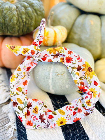 Amanda Bright Designs cotton fall headband featuring a colorful floral and leaf pattern squirrels and mushrooms on a white background