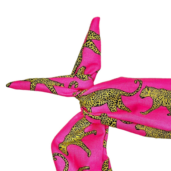 Amanda Bright Designs bright pink headband with a black and yellow leopard print styled in a knot