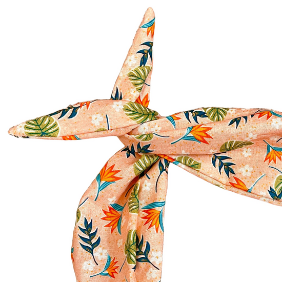 Amanda Bright Designs peach-colored scarf with a tropical leaf and bird-of-paradise print