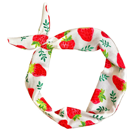 Amanda Bright Designs cotton denim headband with a red strawberry and green leaf pattern, tied in a knot 