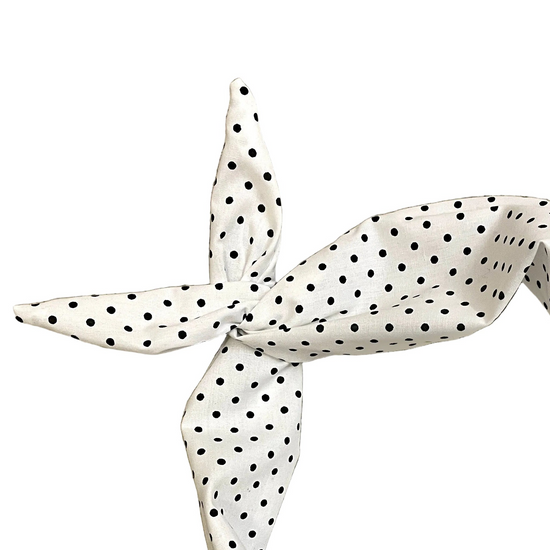 Amanda Bright Designs white cotton headband with a black polka dot pattern, styled in a knot 