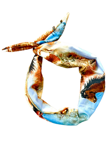 Amanda Bright Designs multicolored tie headband featuring a pattern of running horses against a blue sky.