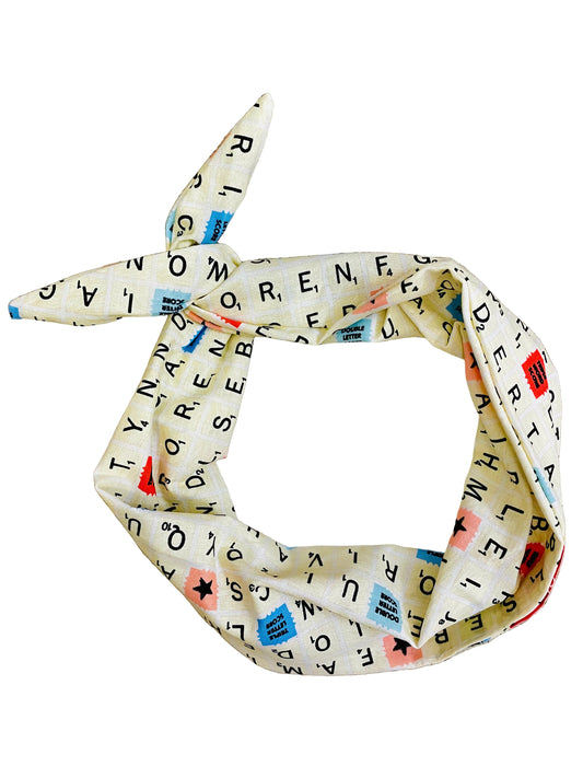 Amanda Bright Designs Word Games Headband featuring cream colored tiles with letters and brightly colored tiles from board game
