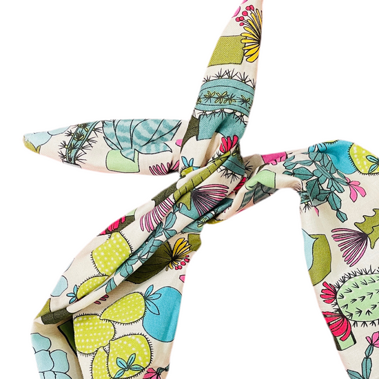 Amanda Bright Designs colorful cactus and succulent pattern on a cream background heaband