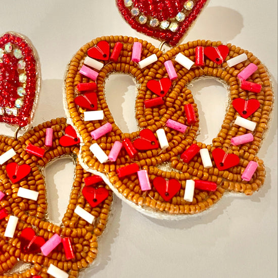 Amanda Bright Designs Heart-shaped pretzel earrings with red, white, and pink beads 
