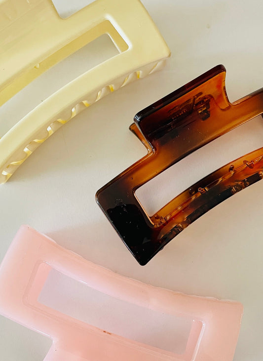Amanda Bright Designs Three rectangular hair clips in beige, tortoiseshell, and pink on a white background