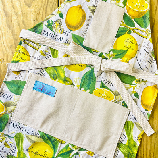 Two Medium Sized Ladies Brittany Apron yellow and green botanical print fabric lemons flowers the botanical register apron