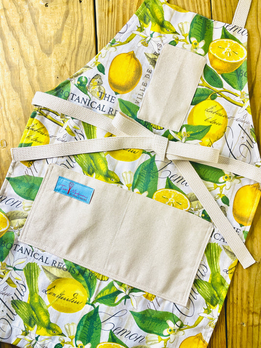 Two Medium Sized Ladies Brittany Apron yellow and green botanical print fabric lemons flowers the botanical register apron