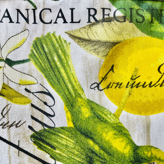 Two Medium Sized Ladies Brittany Apron yellow and green botanical print fabric lemons flowers the botanical register apron fabric pattern