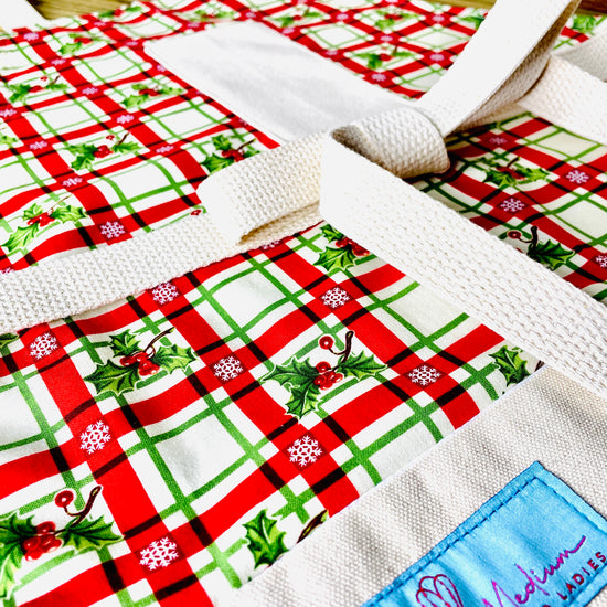 Two Medium Sized Ladies Christmas Plaid Red and Green Holly Berry Vintage Style Apron Close Up View