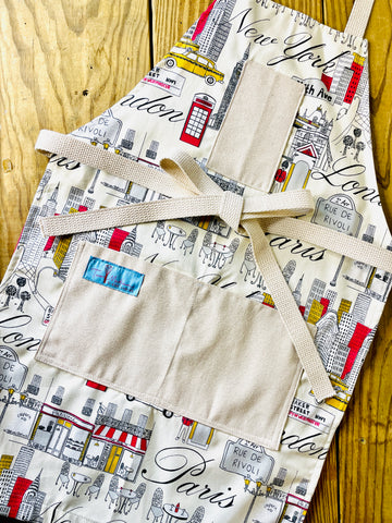 Two Medium Sized Ladies Evelyn Apron London New York City Paris skyscrapers cafe streets cityscape icon midcentury travel apron