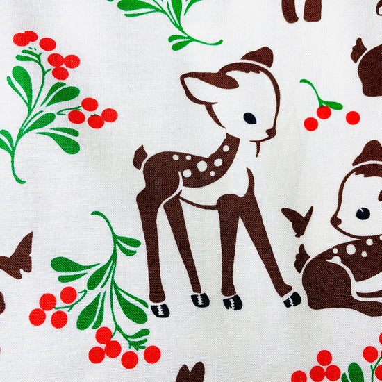 Two Medium Sized Ladies pattern for cotton apron Winter Forest Fawn featuring baby deer butterflies and green and red foliage
