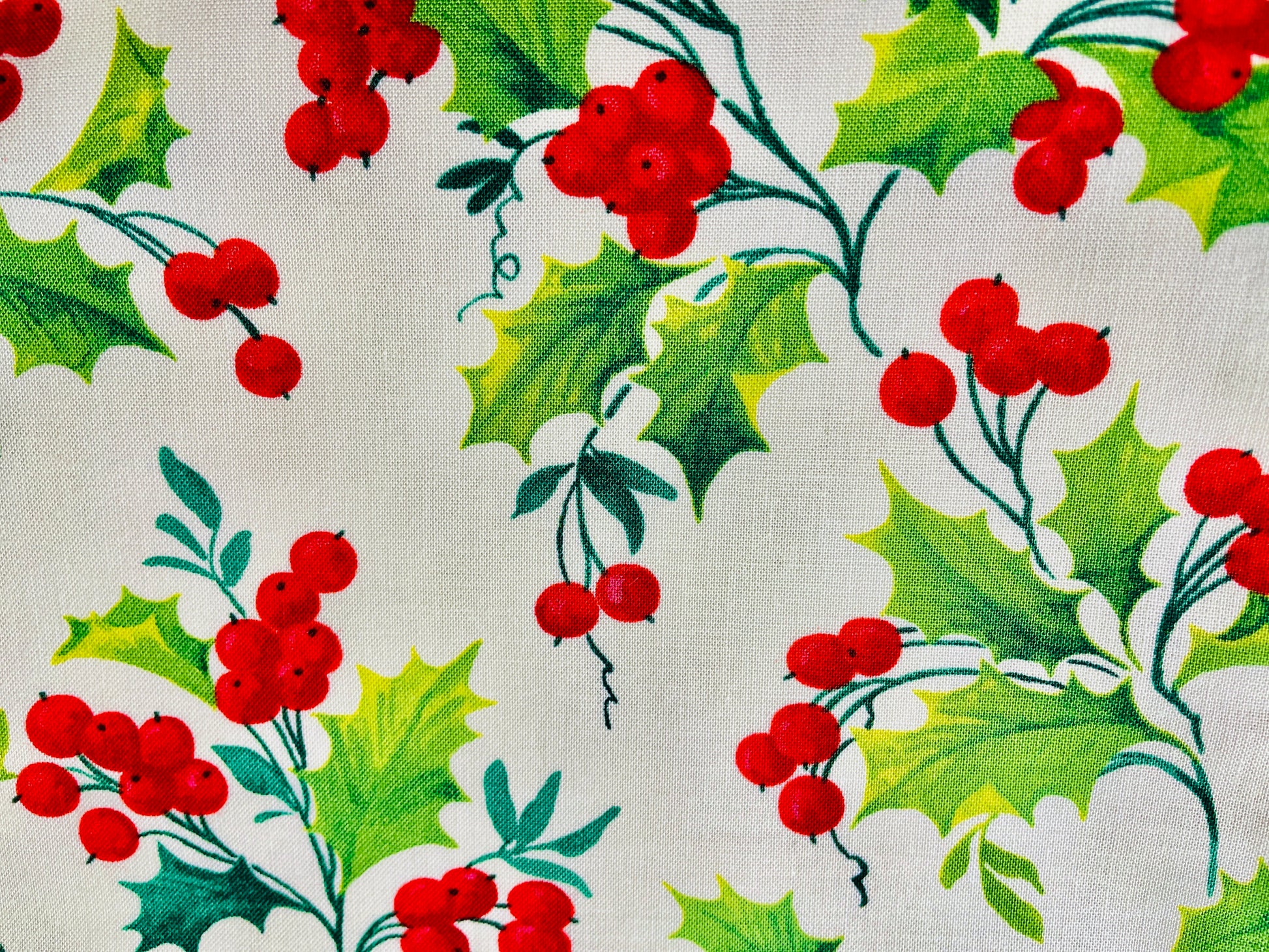 Two Medium Sized Ladies bright red berries and bright green holly leaves on the pattern for holly berry winter wonderland apron