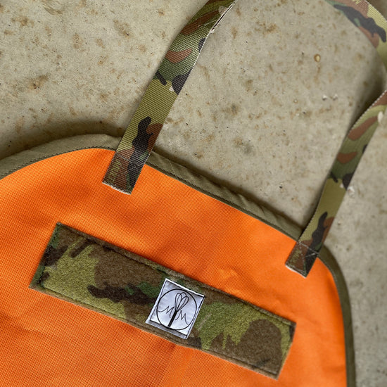 Two Medium Sized Ladies The McFly Back to the Future mens apron Ottertex orange waterproof canvas with Multicam 1" nylon strings Multicam hook and loop minimalist black and white logo