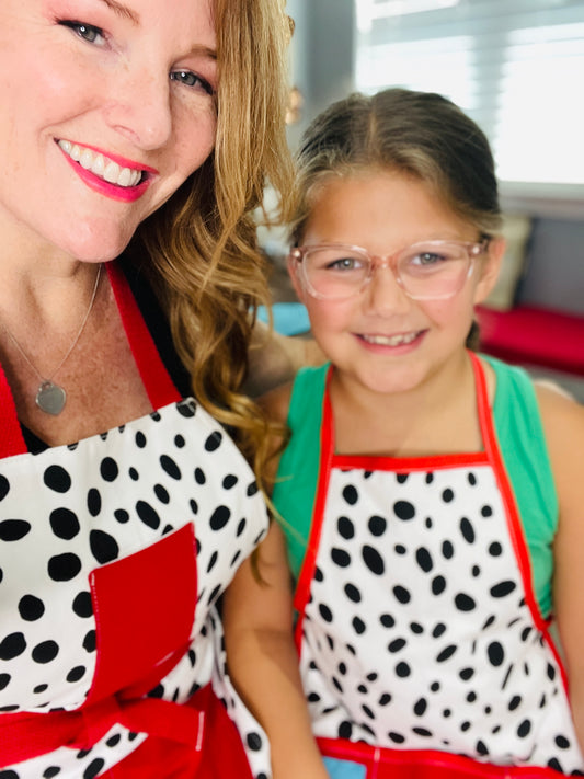 Two Medium Sized Ladies Dalmatian Print Mommy & Me Apron Set Children's Adult White with Black Spots Red Trim and Red Apron Strings Made in Texas 