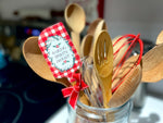 Two Medium Sized Ladies Baking Spirits Bright silicone two sided spatula with red gingham check and wreath design decorated with festive red bow and loop for hanging