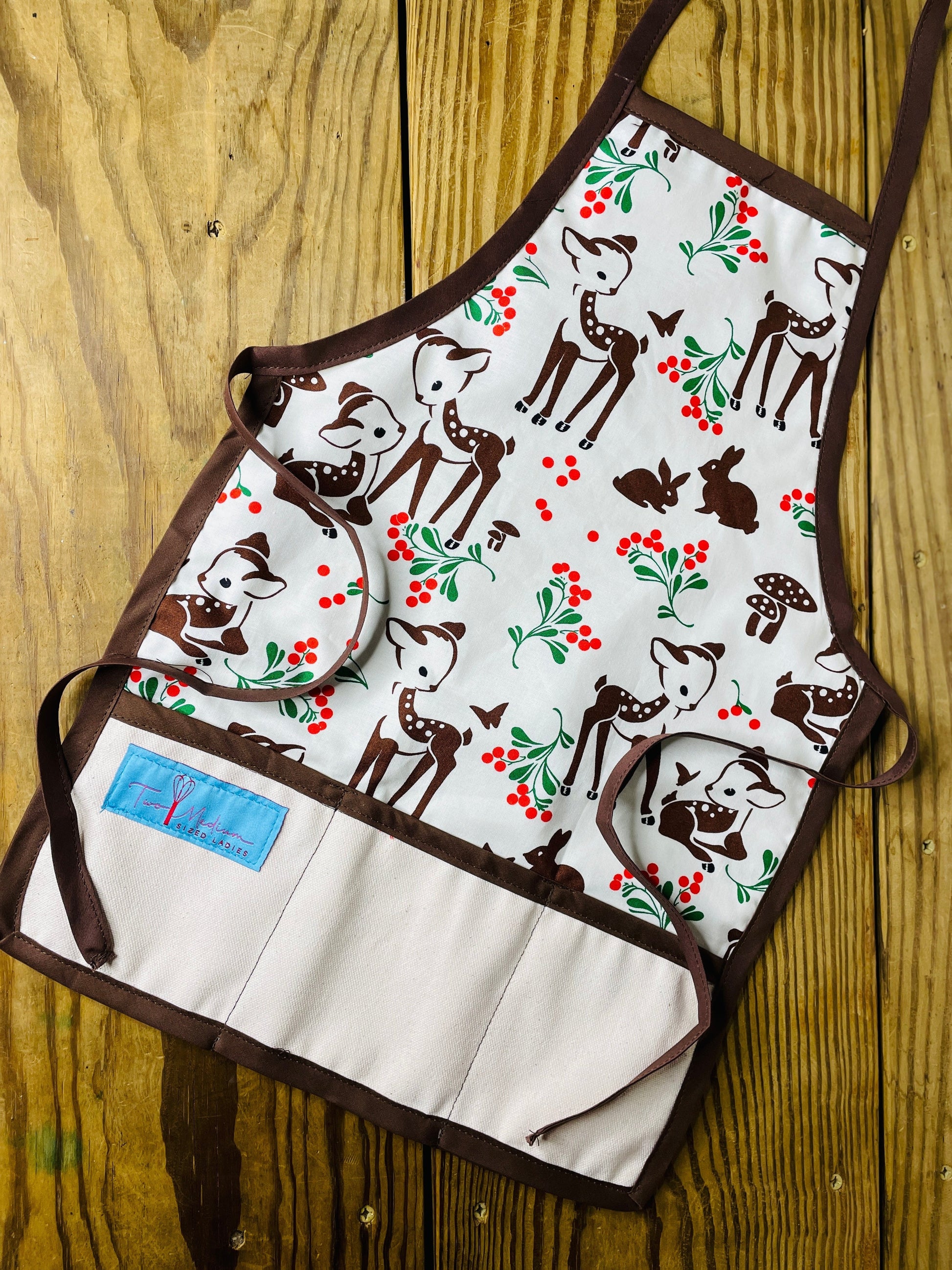 Two Medium Sized Ladies Forest Fawn Children's Christmas Apron Forest Fawn Reindeer Rudolph Chocolate Brown Apron strings and trim