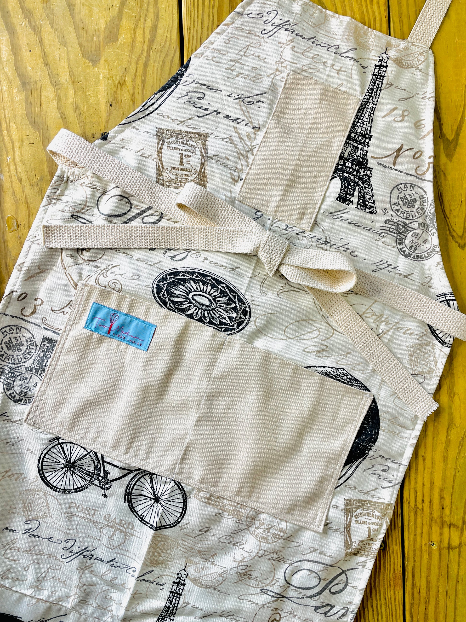 Two Medium Sized Ladies Madeleine Apron Paris lifestyle Eiffel Tower bicycle postmarks travel language vintage style designer apron