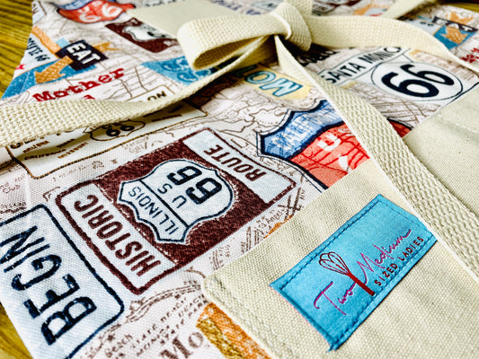 Two Medium Sized Ladies Rhonda Road Trip Route 66 Apron Collection American car travel highway signs map diner Santa Monica California History Kitchen Apron close up view