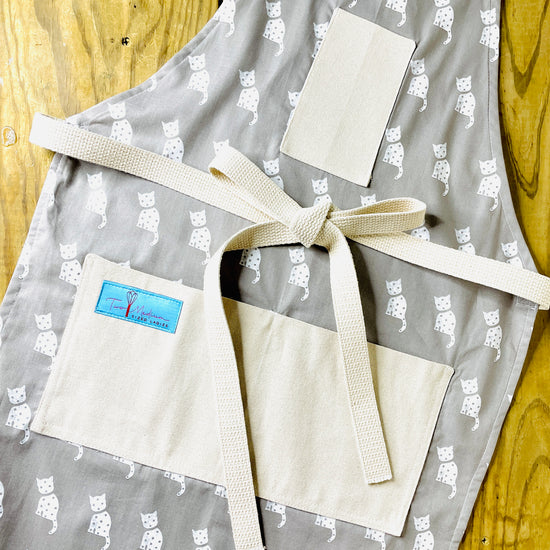 Amanda Bright Designs Tammi white cat gray background kitchen animal lovers apron farmhouse style