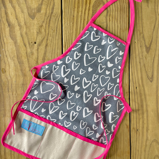 Two Medium Sized Ladies Amie children's apron pink trim valentines hearts amour France Paris love month apron baking cooking kitchen playtime